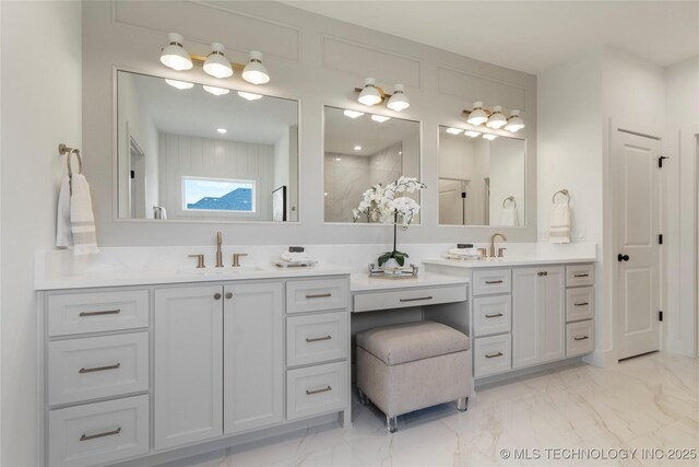 2338 E 134th St S, Bixby, OK 74008 - full bathroom featuring double vanity, marble finish flooring, and a tile shower