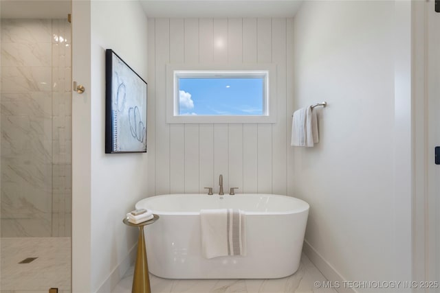 2338 E 134th St S, Bixby, OK 74008 - bathroom featuring a freestanding bath, marble look tiles, and a tile shower