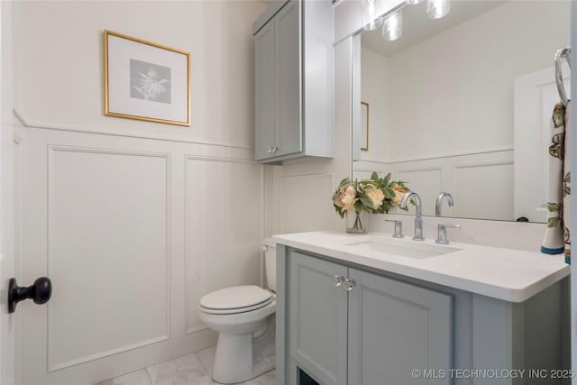 2338 E 134th St S, Bixby, OK 74008 - bathroom with a decorative wall, vanity, and wainscoting
