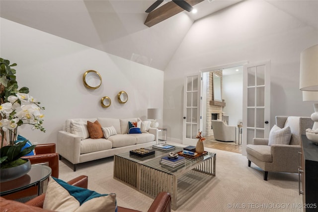 2338 E 134th St S, Bixby, OK 74008 - living area with ceiling fan, high vaulted ceiling, and a fireplace