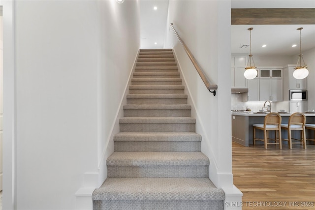 2338 E 134th St S, Bixby, OK 74008 - stairs with wood finished floors and recessed lighting