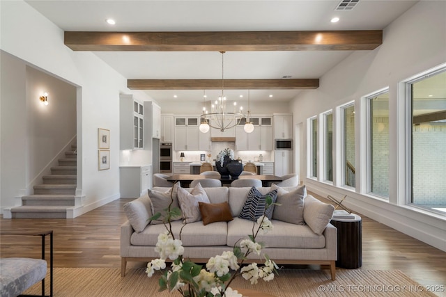 2338 E 134th St S, Bixby, OK 74008 - living room featuring wood finished floors, a chandelier, recessed lighting, beam ceiling, and stairs