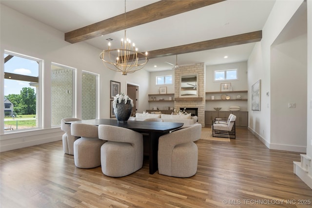 2338 E 134th St S, Bixby, OK 74008 - dining room with wood finished floors, a fireplace, a chandelier, recessed lighting, and beamed ceiling
