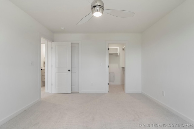 2338 E 134th St S, Bixby, OK 74008 - unfurnished bedroom featuring light colored carpet, a spacious closet, and ceiling fan