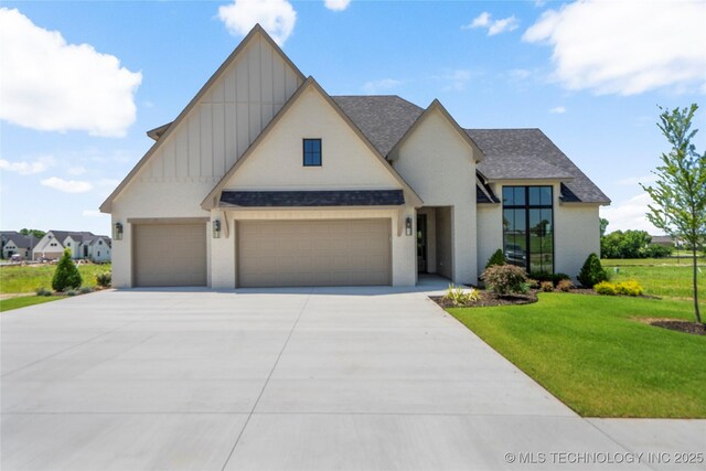 2338 E 134th St S, Bixby, OK 74008 - view of front facade with board and batten siding, an attached garage, concrete driveway, roof with shingles, and a front yard