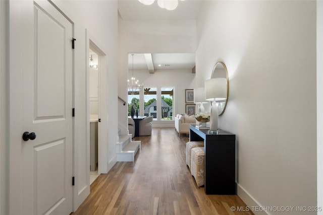 2338 E 134th St S, Bixby, OK 74008 - hall with stairs, a chandelier, wood finished floors, and beamed ceiling