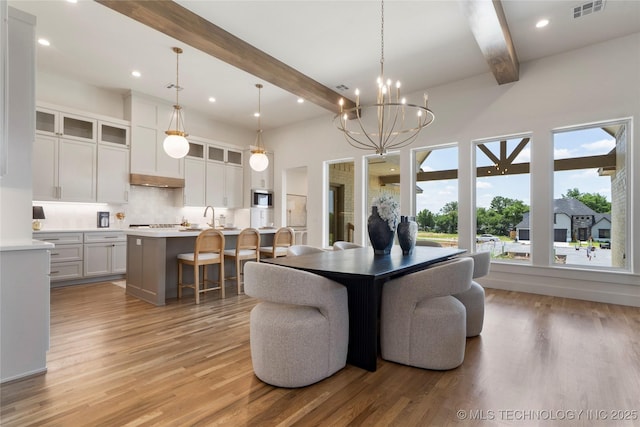 2338 E 134th St S, Bixby, OK 74008 - dining space with beam ceiling, light wood finished floors, a chandelier, and recessed lighting