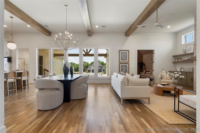 2338 E 134th St S, Bixby, OK 74008 - living room featuring light wood-style floors, beam ceiling, ceiling fan, recessed lighting, and a chandelier