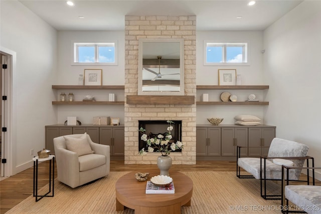 2338 E 134th St S, Bixby, OK 74008 - living area with light wood-style flooring, healthy amount of natural light, recessed lighting, and a fireplace