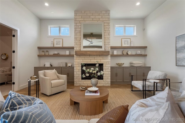 2338 E 134th St S, Bixby, OK 74008 - living room with plenty of natural light, wood finished floors, recessed lighting, and a fireplace