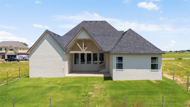 2338 E 134th St S, Bixby, OK 74008 - back of house with brick siding, a patio area, and a shingled roof