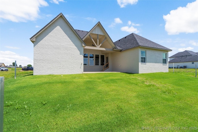 2338 E 134th St S, Bixby, OK 74008 - back of house featuring brick siding and a yard