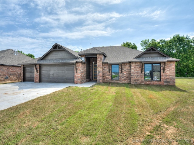 13155 S 105th E Ave, Bixby, OK 74008 - view of front of home featuring an attached garage, concrete driveway, a front lawn, roof with shingles, and brick siding