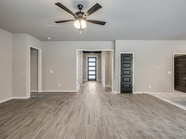 13155 S 105th E Ave, Bixby, OK 74008 - unfurnished living room featuring a ceiling fan, wood finished floors, and baseboards