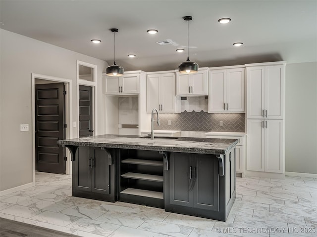 13155 S 105th E Ave, Bixby, OK 74008 - kitchen with light marble finish floors, baseboards, a sink, and recessed lighting