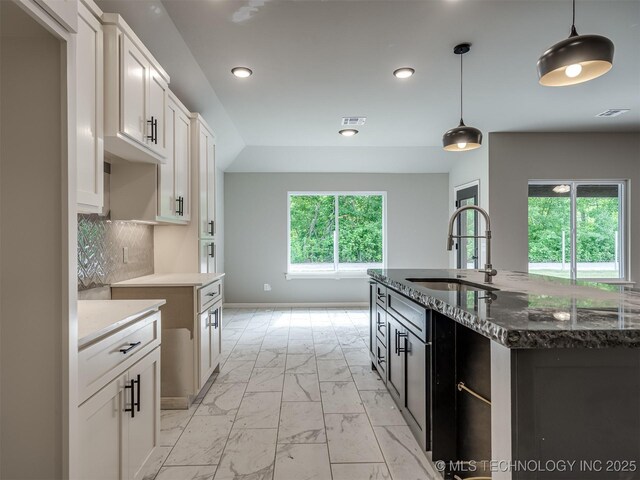 13155 S 105th E Ave, Bixby, OK 74008 - kitchen with light marble finish floors, a sink, recessed lighting, dark stone counters, and pendant lighting