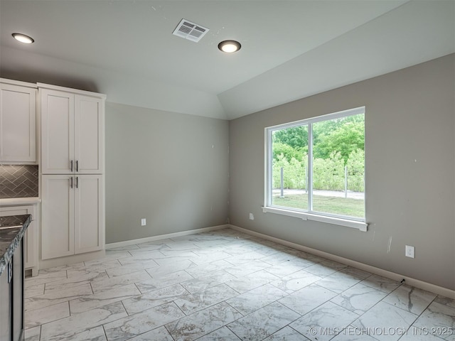 13155 S 105th E Ave, Bixby, OK 74008 - interior space featuring light marble finish flooring, baseboards, vaulted ceiling, and recessed lighting