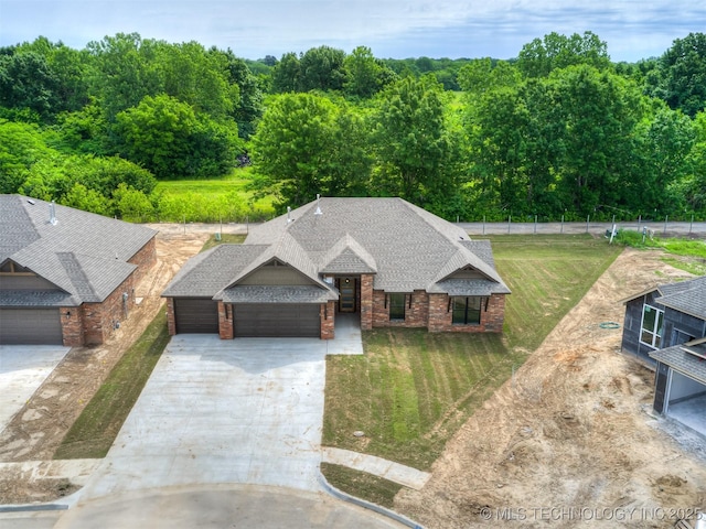 13155 S 105th E Ave, Bixby, OK 74008 - view of front facade featuring an attached garage, concrete driveway, a front yard, and brick siding