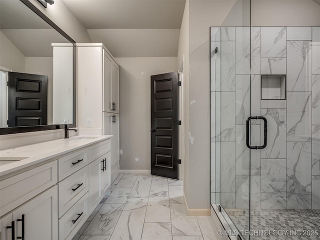 13155 S 105th E Ave, Bixby, OK 74008 - full bathroom with marble look tile flooring, baseboards, a stall shower, and double vanity