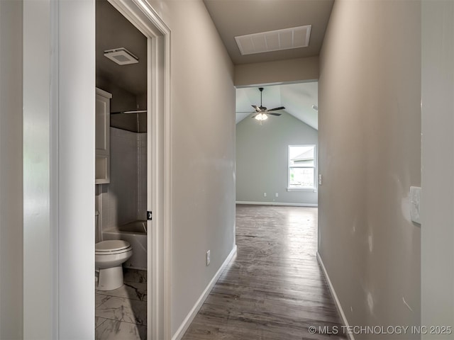 13155 S 105th E Ave, Bixby, OK 74008 - hall featuring baseboards, vaulted ceiling, and wood finished floors