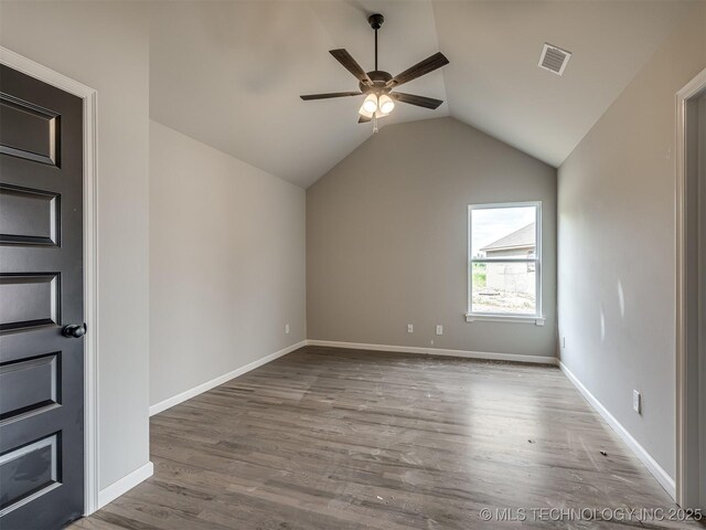 13155 S 105th E Ave, Bixby, OK 74008 - unfurnished room featuring lofted ceiling, ceiling fan, wood finished floors, and baseboards