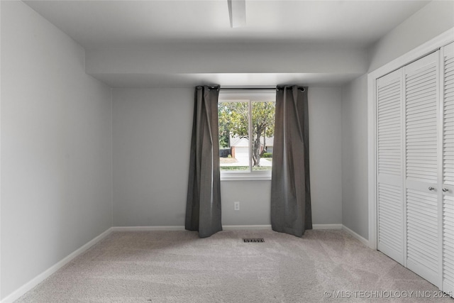 7532 E 55th Pl, Tulsa, OK 74145 - unfurnished bedroom with carpet, baseboards, and a closet