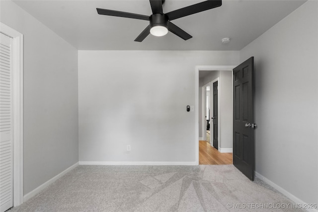7532 E 55th Pl, Tulsa, OK 74145 - unfurnished bedroom with light colored carpet, baseboards, and a ceiling fan