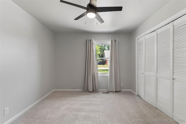 7532 E 55th Pl, Tulsa, OK 74145 - unfurnished bedroom with light colored carpet, a closet, baseboards, and a ceiling fan