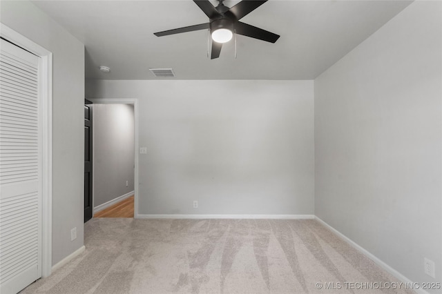 7532 E 55th Pl, Tulsa, OK 74145 - unfurnished bedroom with carpet, baseboards, and ceiling fan