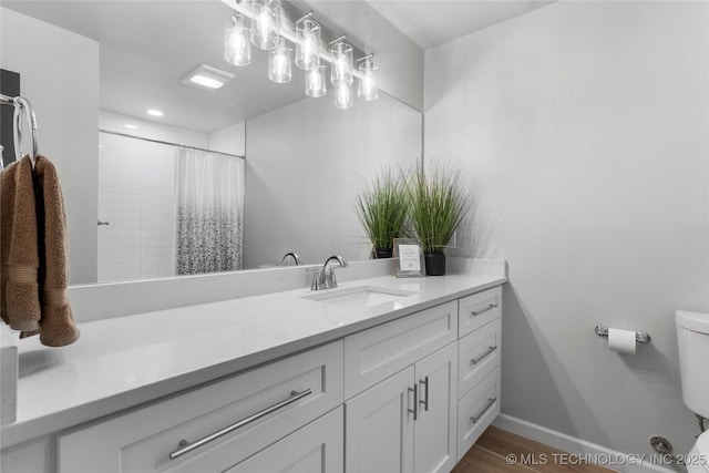7532 E 55th Pl, Tulsa, OK 74145 - bathroom featuring vanity, toilet, baseboards, wood finished floors, and curtained shower
