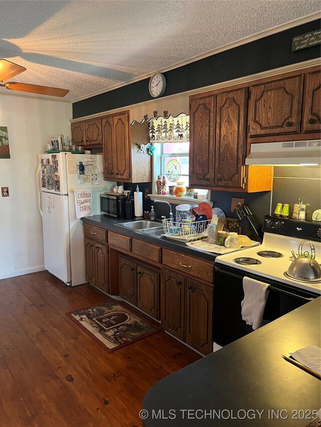 95398 S 4556, Vian, OK 74962 - kitchen with range with electric stovetop, under cabinet range hood, freestanding refrigerator, a textured ceiling, and dark wood-style floors