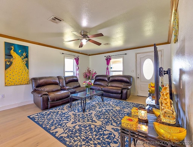 7008 S Hwy 28, Chelsea, OK 74016 - living room featuring wood finished floors, ceiling fan, ornamental molding, and baseboards