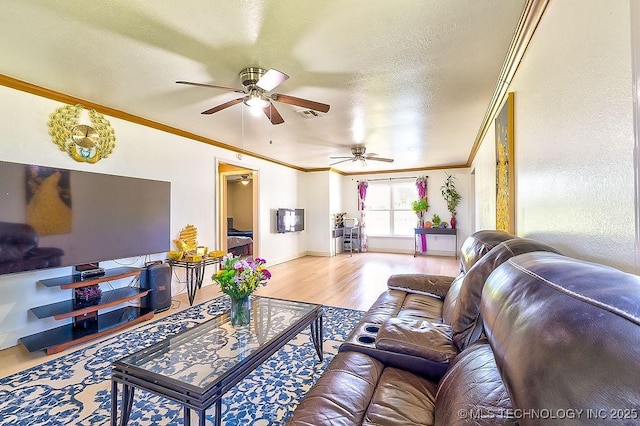 7008 S Hwy 28, Chelsea, OK 74016 - living room featuring a ceiling fan, ornamental molding, wood finished floors, a textured ceiling, and baseboards