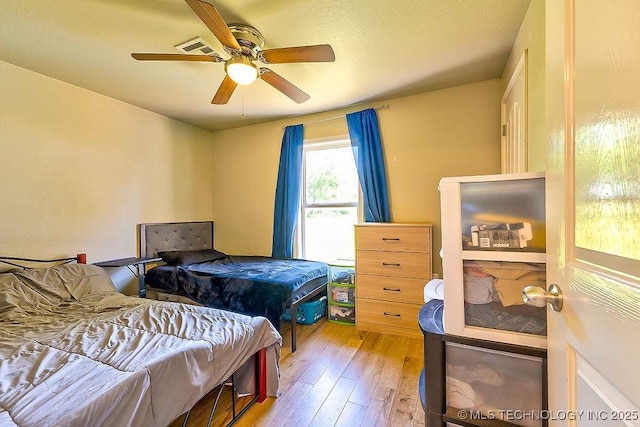 7008 S Hwy 28, Chelsea, OK 74016 - bedroom featuring wood-type flooring and a ceiling fan