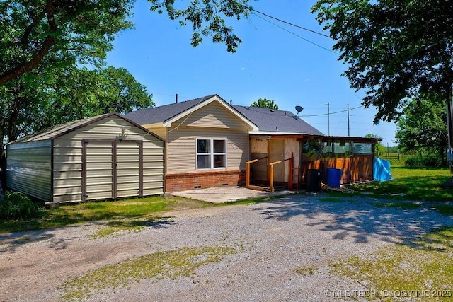7008 S Hwy 28, Chelsea, OK 74016 - back of house with brick siding