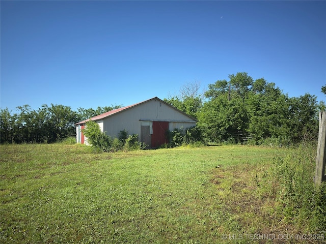7008 S Hwy 28, Chelsea, OK 74016 - view of grassy yard with an outbuilding and a pole building