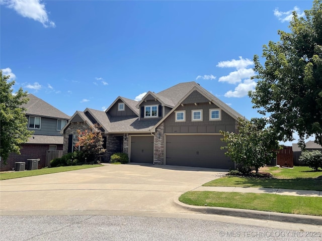 2613 W Van Buren Ct, Broken Arrow, OK 74011 - craftsman-style home featuring driveway, central AC unit, board and batten siding, stone siding, and an attached garage