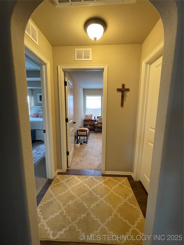 2613 W Van Buren Ct, Broken Arrow, OK 74011 - hallway with arched walkways, carpet, and baseboards