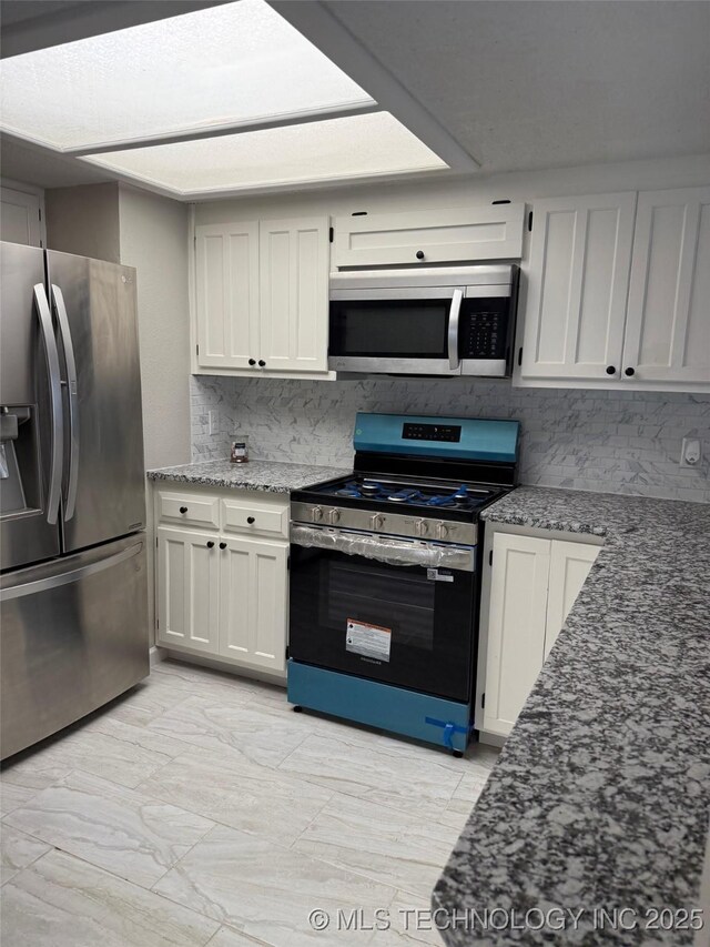 2800 E Seattle St, Broken Arrow, OK 74014 - kitchen featuring appliances with stainless steel finishes, tasteful backsplash, stone counters, white cabinets, and light marble finish flooring
