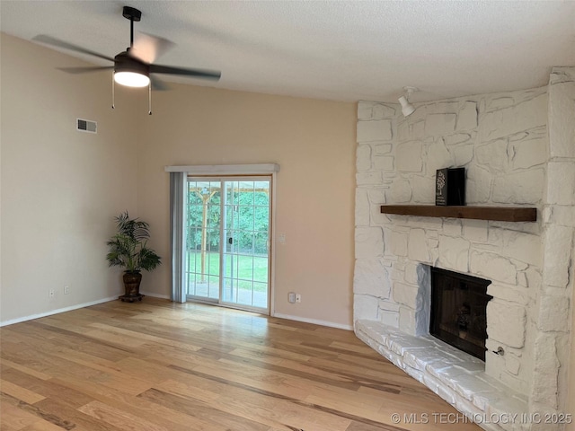 2800 E Seattle St, Broken Arrow, OK 74014 - unfurnished living room with ceiling fan, a fireplace, light wood finished floors, and baseboards