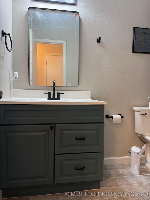 2800 E Seattle St, Broken Arrow, OK 74014 - half bath featuring toilet, vanity, wood finished floors, and baseboards
