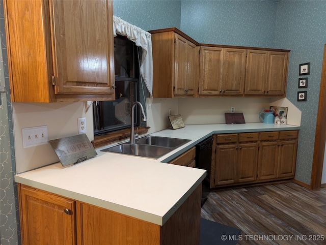 11309 S 107th E Ave, Bixby, OK 74008 - kitchen featuring a sink, wallpapered walls, light countertops, dark wood-style floors, and brown cabinets