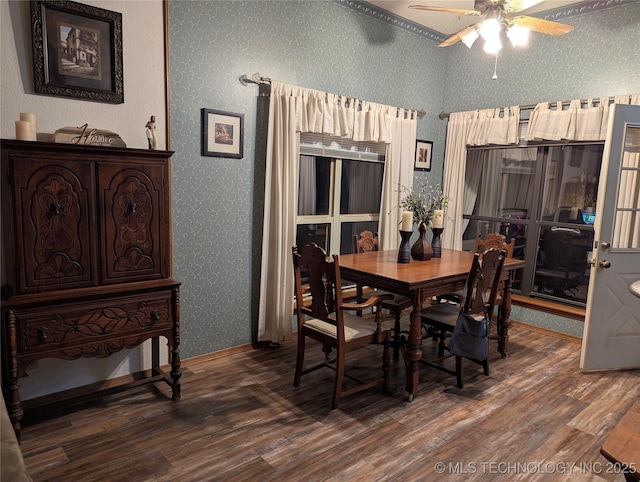 11309 S 107th E Ave, Bixby, OK 74008 - dining space with wallpapered walls, wood finished floors, a ceiling fan, and baseboards