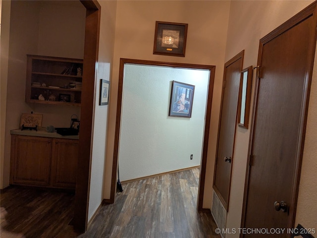 11309 S 107th E Ave, Bixby, OK 74008 - hallway with dark wood-style floors and baseboards