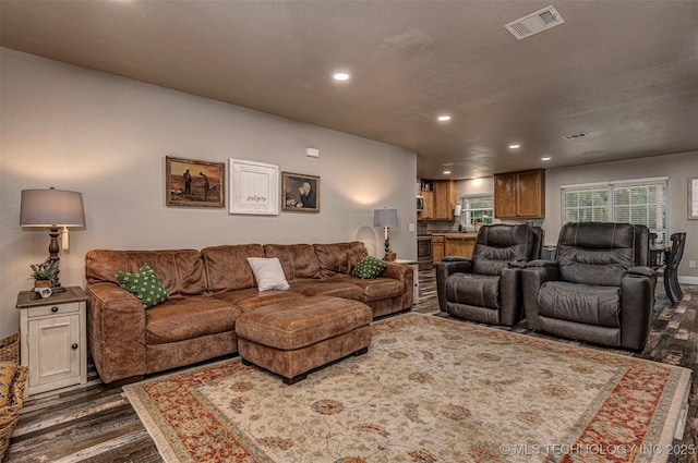 1319 SE 3rd St, Antlers, OK 74523 - living room featuring dark wood-type flooring, recessed lighting, and baseboards