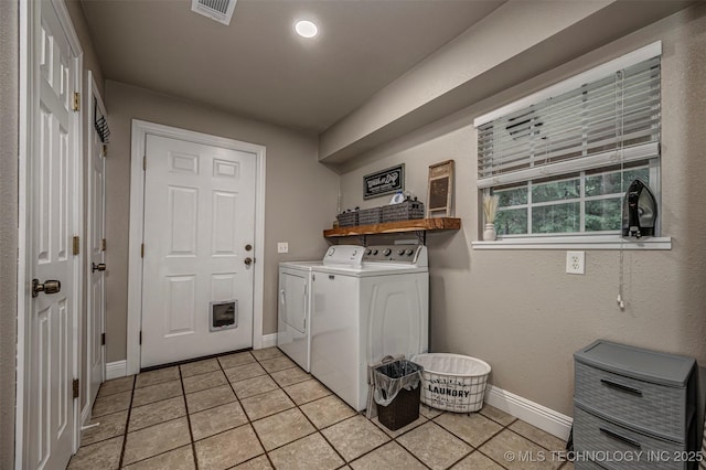 1319 SE 3rd St, Antlers, OK 74523 - laundry room featuring washer and dryer, light tile patterned flooring, and baseboards