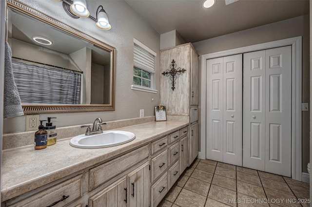 1319 SE 3rd St, Antlers, OK 74523 - bathroom featuring vanity, tile patterned flooring, toilet, and a closet