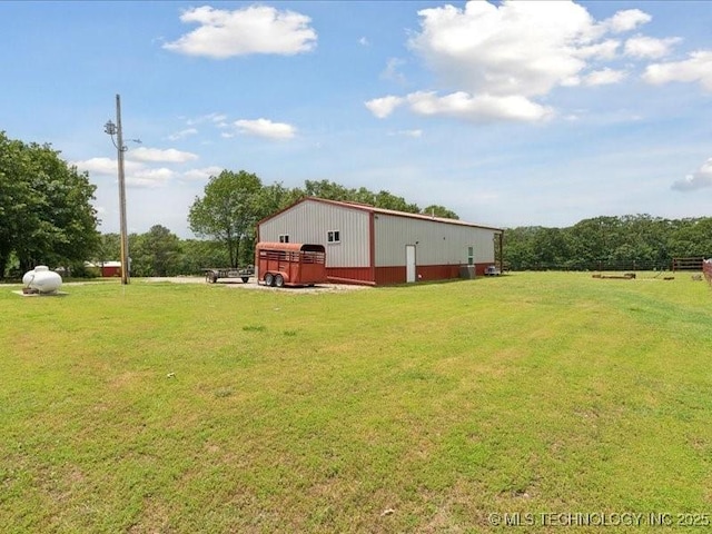 25301 E 330th Rd, Chelsea, OK 74016 - view of grassy yard featuring an outbuilding, a garage, and an outdoor structure
