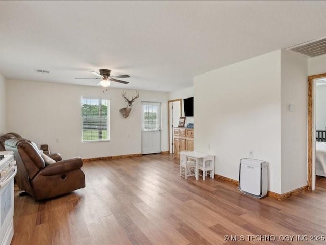 25301 E 330th Rd, Chelsea, OK 74016 - sitting room with a ceiling fan, light wood-type flooring, and baseboards