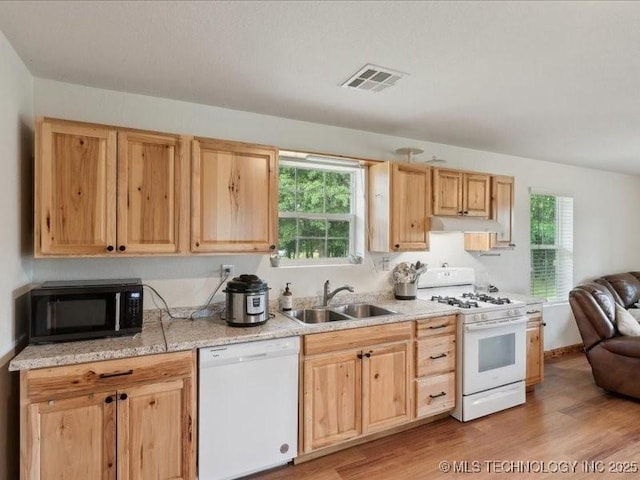 25301 E 330th Rd, Chelsea, OK 74016 - kitchen featuring white appliances, a sink, under cabinet range hood, and light brown cabinetry